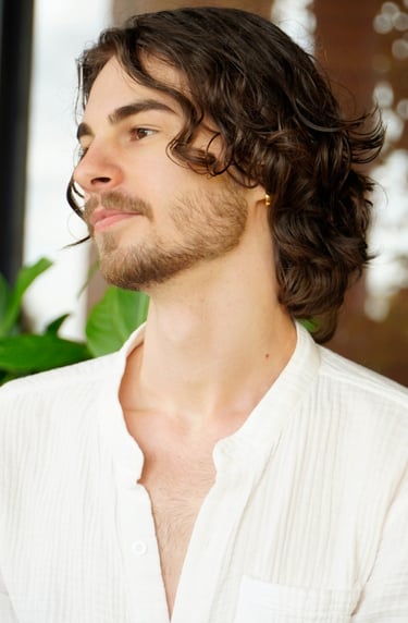 a man with a beard and a white shirt