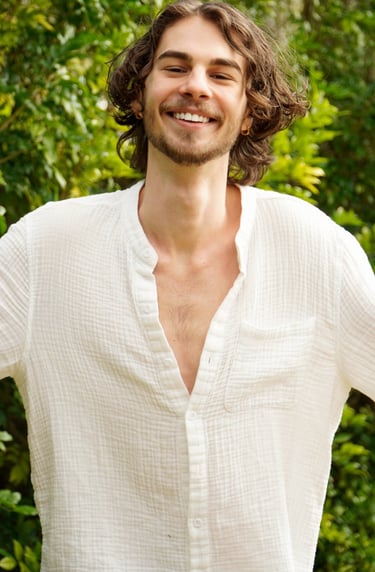 a man with a beard and a white shirt