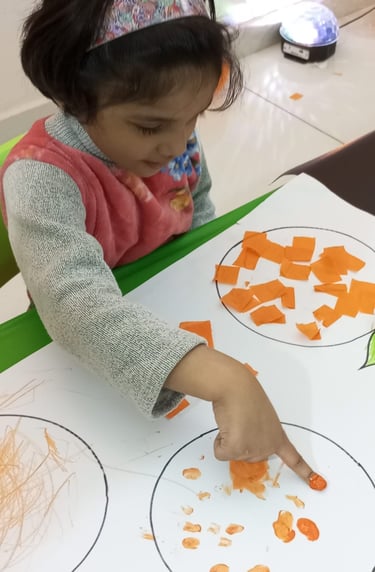 Child enjoying tactile play with sensory materials