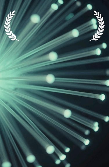 An abstract, artistic shot of data streams or light fibers glowing in muted seafoam green and slate ocean blue, symbolizing global connectivity and digital creativity.