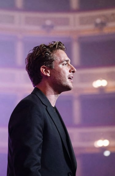 A profile view of Stefan Taylor singing, with a soft-focus background of a grand theater. The color palette features pale lavender mist and muted plum, creating a cinematic and engaging experience.