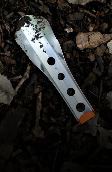 boglerco trowel lying on leafy ground