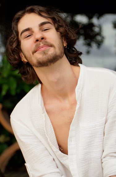 a man with a beard and a white shirt