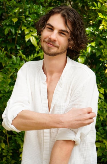 a man with a beard and a white shirt