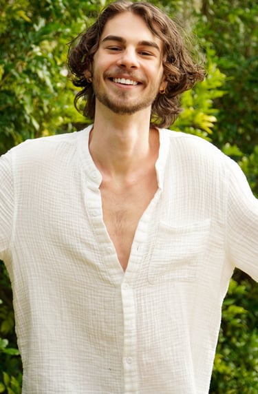 a man with a beard and a white shirt
