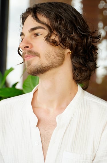 a man with a beard and a white shirt