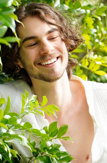 a man with a beard and a white shirt