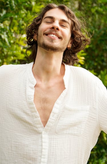 a man with a beard and a white shirt