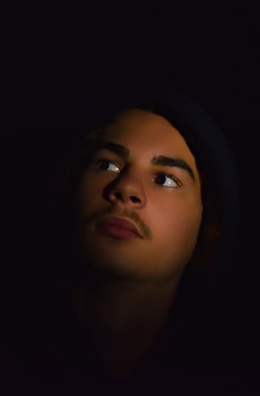 a man with a hoodie and and vigilante lighting