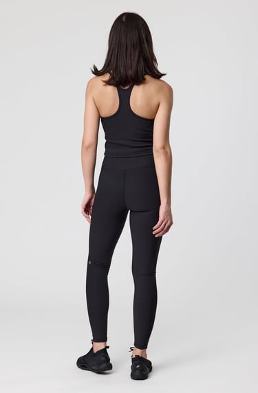 Fashion e-commerce photography - a woman in a black top and leggings