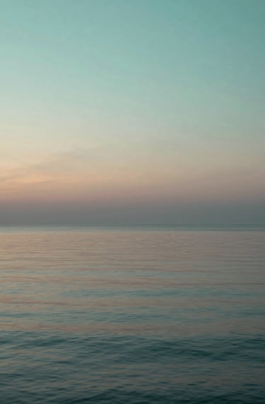 Artistic album cover concept featuring a calm ocean at dawn, reflecting the colors #91AA9D and #386F6F, minimalist and sophisticated style representing peace after a storm.