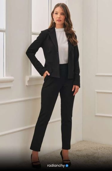 a woman in a black suit and white shirt