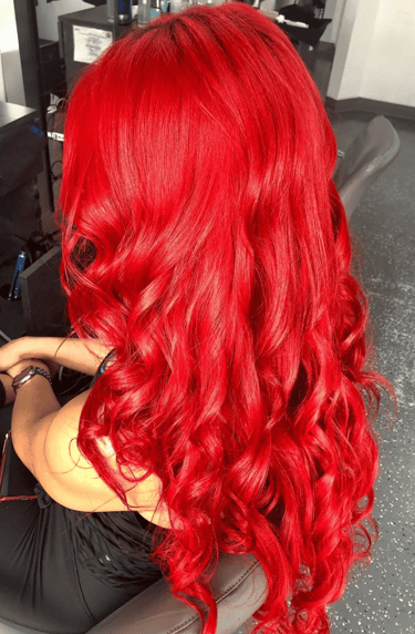 Red hair color styled in Miami by Francis Hair & More with vibrant shine