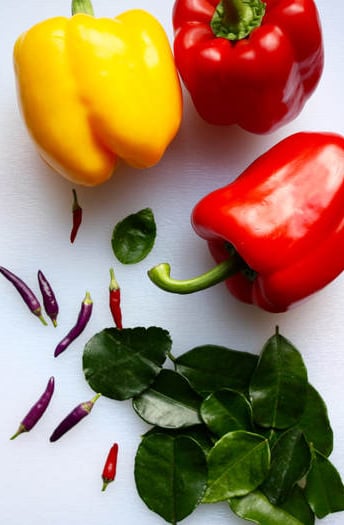 ingredients for lime leaf jelly, peppers, lime leaves and Thai chillies