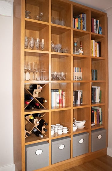 This image shows a tall book case and storage unit built from oak veneered board.