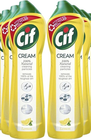 a group of four bottles of cream cream