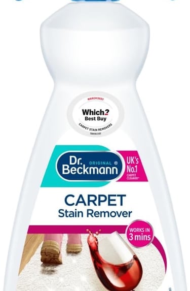 a bottle of carpet cleaner with a cleaning brush