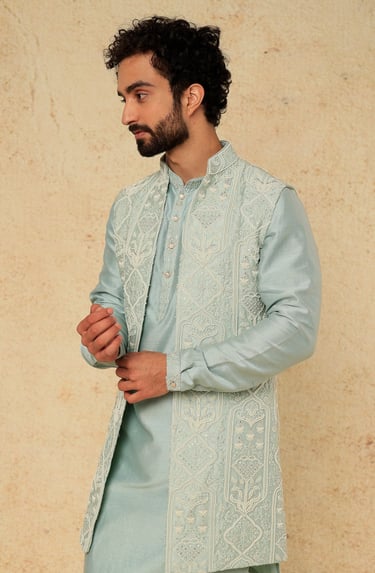 a man in a blue and white suit and a beardless man in a blue