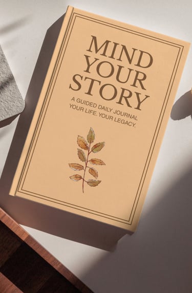 A Mind Your Story guided daily journal with a leaf illustration on a beige cover.