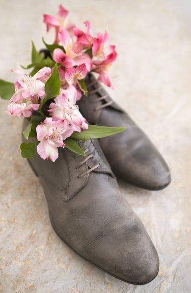 a pair of shoes with flowers on them