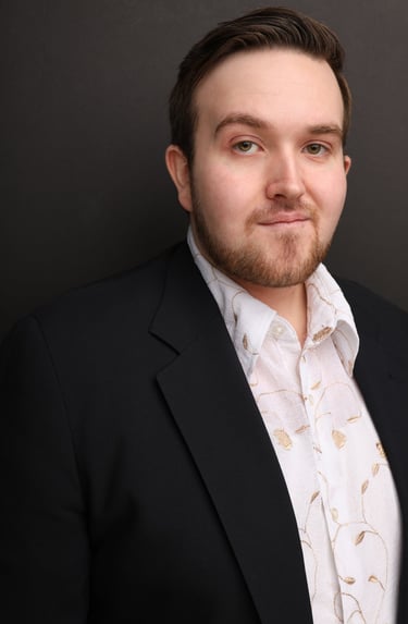 Cade MacFee actor headshot on a gray background