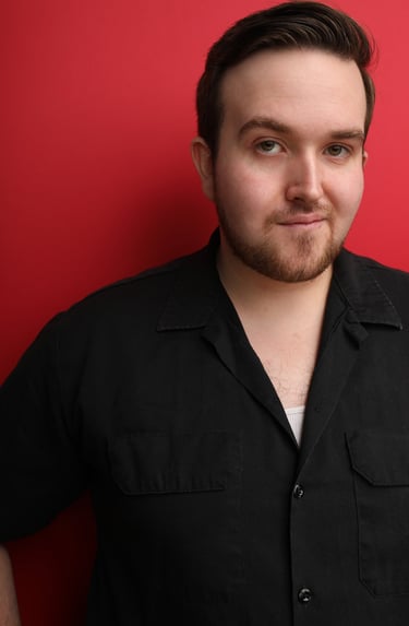 Cade MacFee actor headshot on a red background