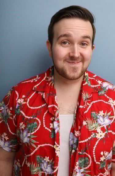 Cade MacFee actor headshot on a blue background