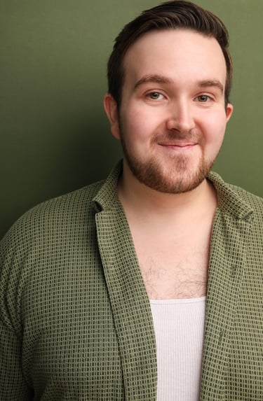 Cade MacFee actor headshot on a green background