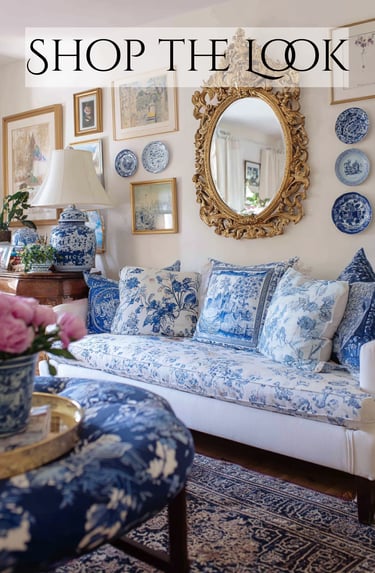 a living room with a couch and a mirror