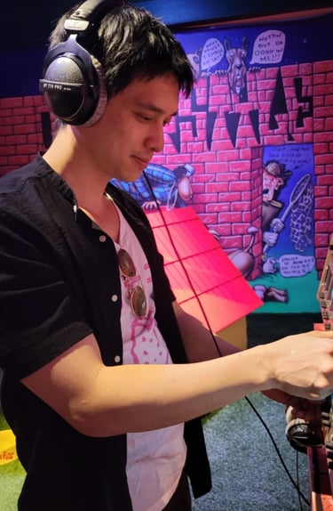 a man in headphones and headphones playing video games
