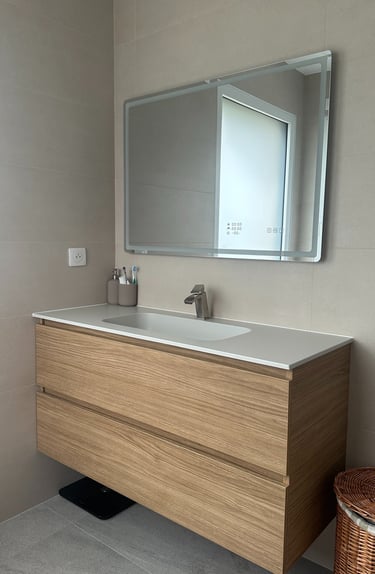 a bathroom with a sink and a mirror