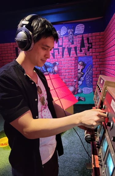 a man in headphones and headphones playing video games