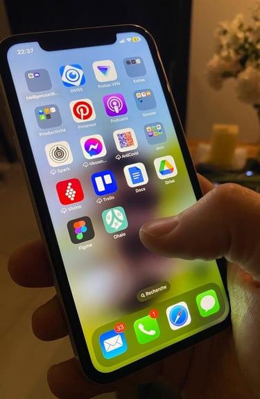 a person holding a phone with a phone in their hand with ohaio app on it