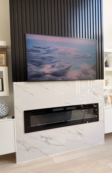 tv mounted on tiled wall with hidden wires