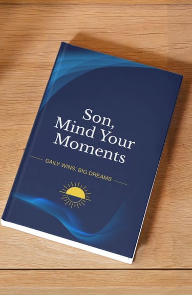 Son, Mind Your Moments journal with a blue cover and sun icon on a wooden table.