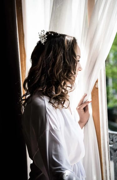 bride looking out of a window