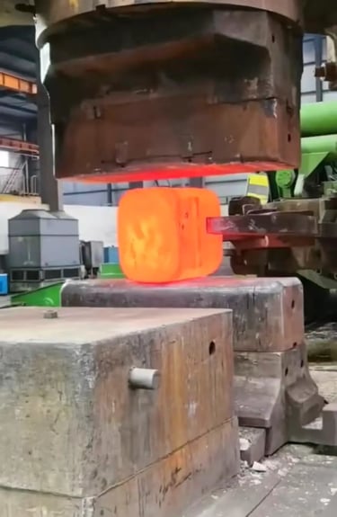 Titanium forging workshop with industrial equipment for custom titanium blocks and forgings