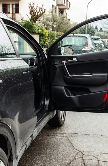 Black luxury car door unlocked representing emergency car lockout services in Spruce Pine, NC