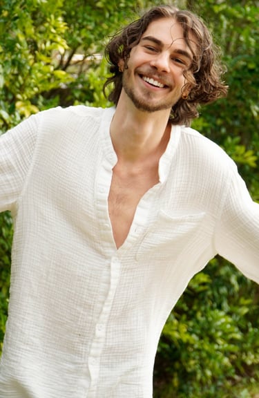 a man with a beard and a white shirt