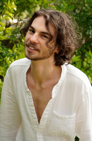 a man with a beard and a white shirt