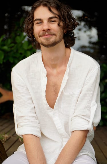 a man with a beard and a white shirt