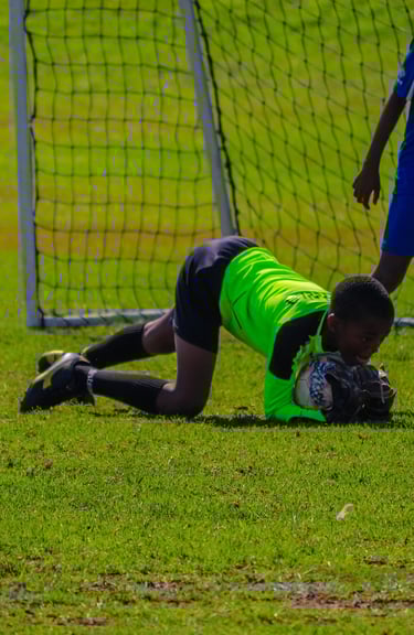 a soccer player is trying to get the ball