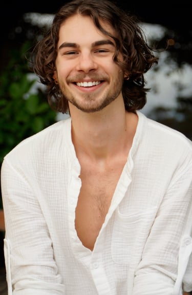a man with a beard and a white shirt