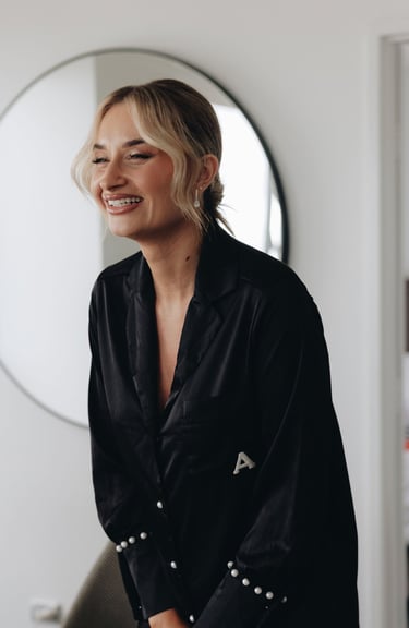 a woman in a black shirt laughing