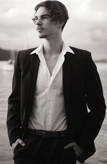 a man in a suit and white shirt