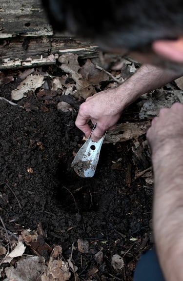man digging with boglerco trowel