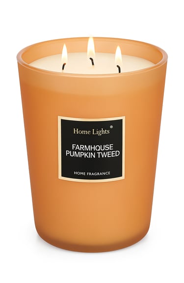 Orange wax candle in glass jar, labeled Pumpkin Spice.