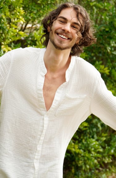 a man with a beard and a white shirt