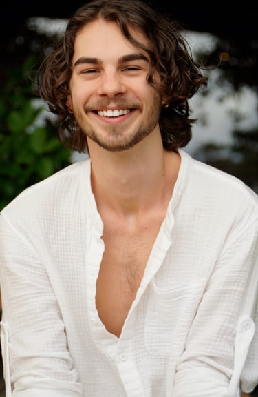 a man with a beard and a white shirt