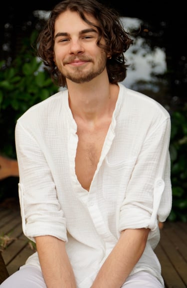 a man with a beard and a white shirt